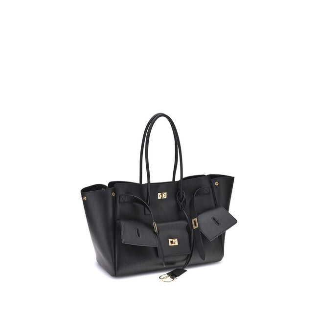 Black Calf Leather Bos Taurus Shoulder BagBalenciaga’s Bel Air medium Shoulder Bag is a spacious and functional accessory with a versatile pouch design. It features two handles for convenient carrying and the Balenciaga Paris logo embossed with silver lam