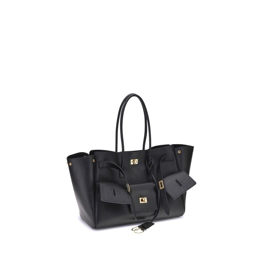 Black Calf Leather Bos Taurus Shoulder BagBalenciaga’s Bel Air medium Shoulder Bag is a spacious and functional accessory with a versatile pouch design. It features two handles for convenient carrying and the Balenciaga Paris logo embossed with silver lam