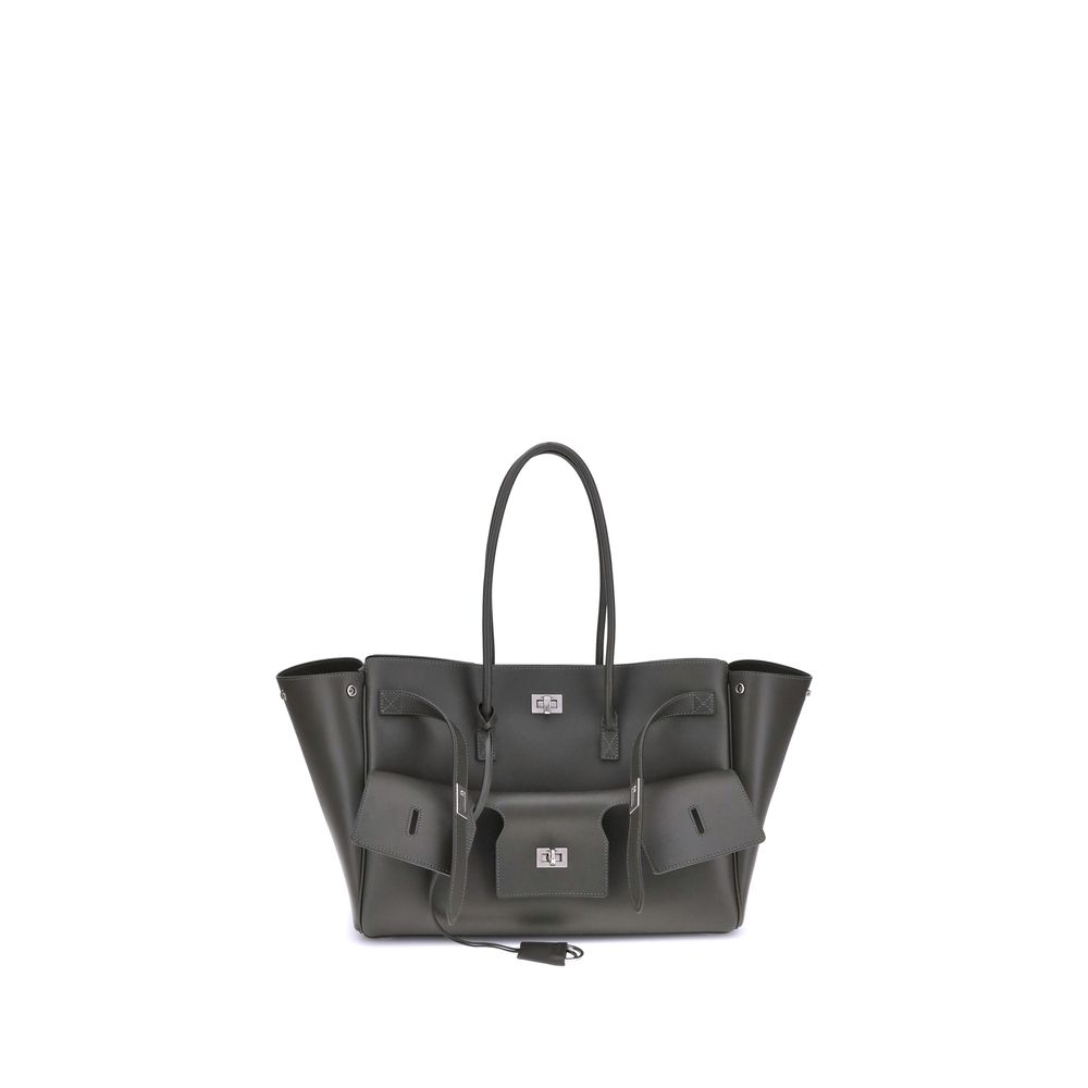 Black Calf Leather Bos Taurus Shoulder BagBalenciaga’s Bel Air medium Shoulder Bag is a spacious and functional accessory with a versatile pouch design. It features two handles for convenient carrying and the Balenciaga Paris logo embossed with silver lam