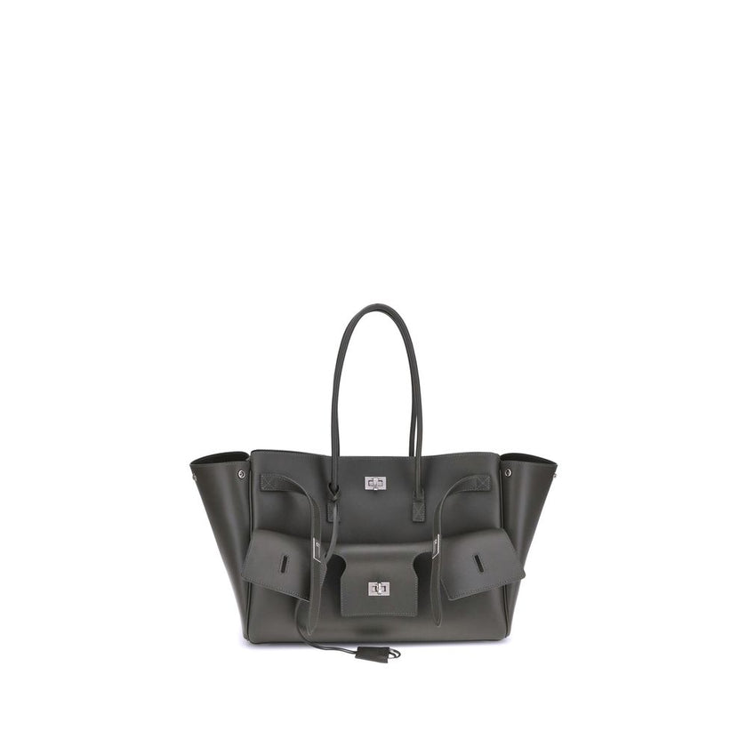 Black Calf Leather Bos Taurus Shoulder BagBalenciaga’s Bel Air medium Shoulder Bag is a spacious and functional accessory with a versatile pouch design. It features two handles for convenient carrying and the Balenciaga Paris logo embossed with silver lam