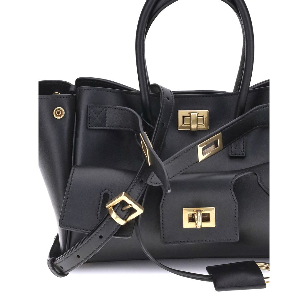 Black Calf Leather Bos Taurus Shoulder BagBalenciaga’s Bel Air mini Handbag is a versatile and iconic accessory. Carried on the shoulder, over the shoulder or by hand, it features two handles and an adjustable, removable shoulder strap. The embossed Balen