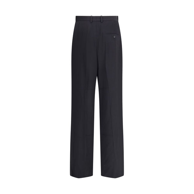 Black Viscose Dress PantsBalenciaga’s tailored Pants feature a zipper and button closure, two side welt pockets and two on the back. Belt loops at the waist complete the garment’s elegant and functional design. Season: AW25 Fit: Regular Composition: 54% V
