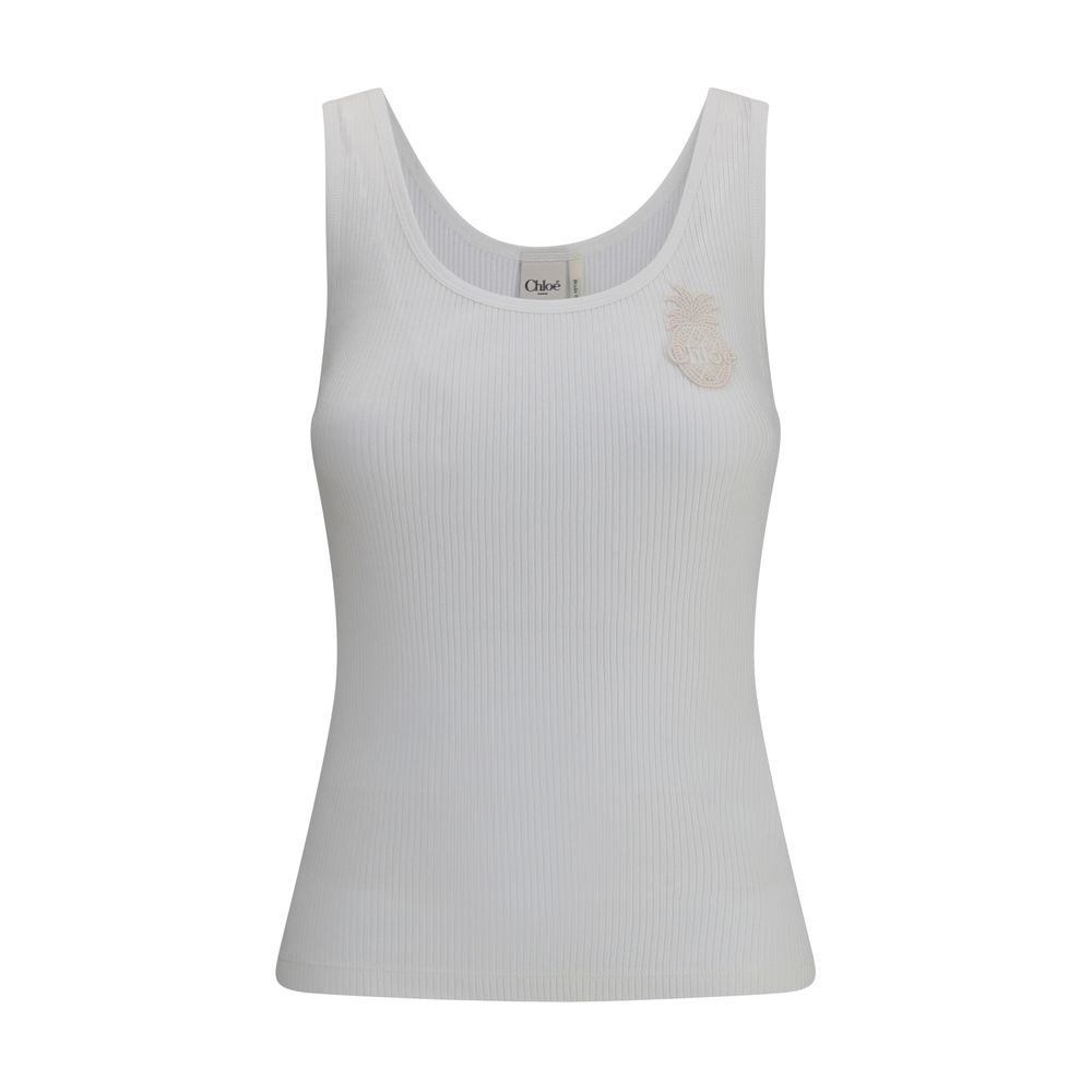 White Cotton TopChloé’s ribbed jersey Top is a versatile and feminine garment. Made of soft ribbed jersey, it offers a comfortable fit that flatters the silhouette. The classic round neckline makes it a passe-partout for a variety of occasions, while a de