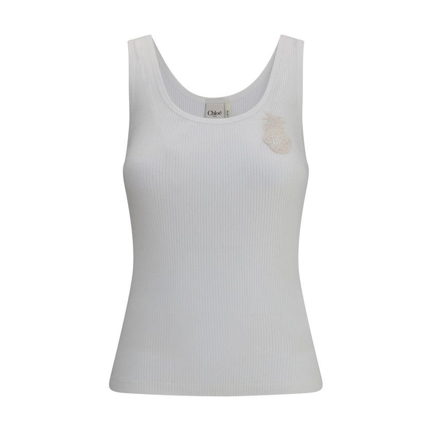 White Cotton TopChloé’s ribbed jersey Top is a versatile and feminine garment. Made of soft ribbed jersey, it offers a comfortable fit that flatters the silhouette. The classic round neckline makes it a passe-partout for a variety of occasions, while a de