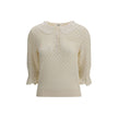 Cream Cotton SweatshirtChloé Sweater is a refined piece that combines delicacy and craftsmanship. It features a distinctive embroidered collar that adds a touch of elegance, and a mid-bust front button closure that defines the style. The openwork knit des