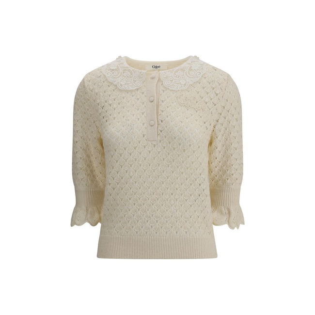 Cream Cotton SweatshirtChloé Sweater is a refined piece that combines delicacy and craftsmanship. It features a distinctive embroidered collar that adds a touch of elegance, and a mid-bust front button closure that defines the style. The openwork knit des