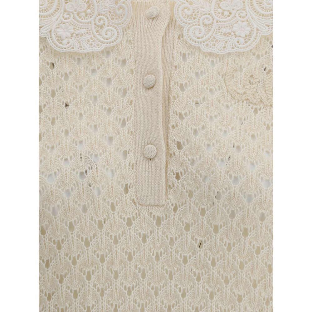 Cream Cotton SweatshirtChloé Sweater is a refined piece that combines delicacy and craftsmanship. It features a distinctive embroidered collar that adds a touch of elegance, and a mid-bust front button closure that defines the style. The openwork knit des