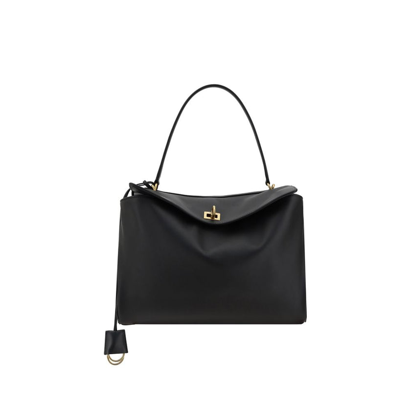 Black Calf Leather Bos Taurus Shoulder BagBalenciaga’s leather Rodeo Shoulder Bag features a top handle for a comfortable and stylish grip. The front closure features a flap and swivel, adding a distinctive and functional detail. Applied keychain detail o