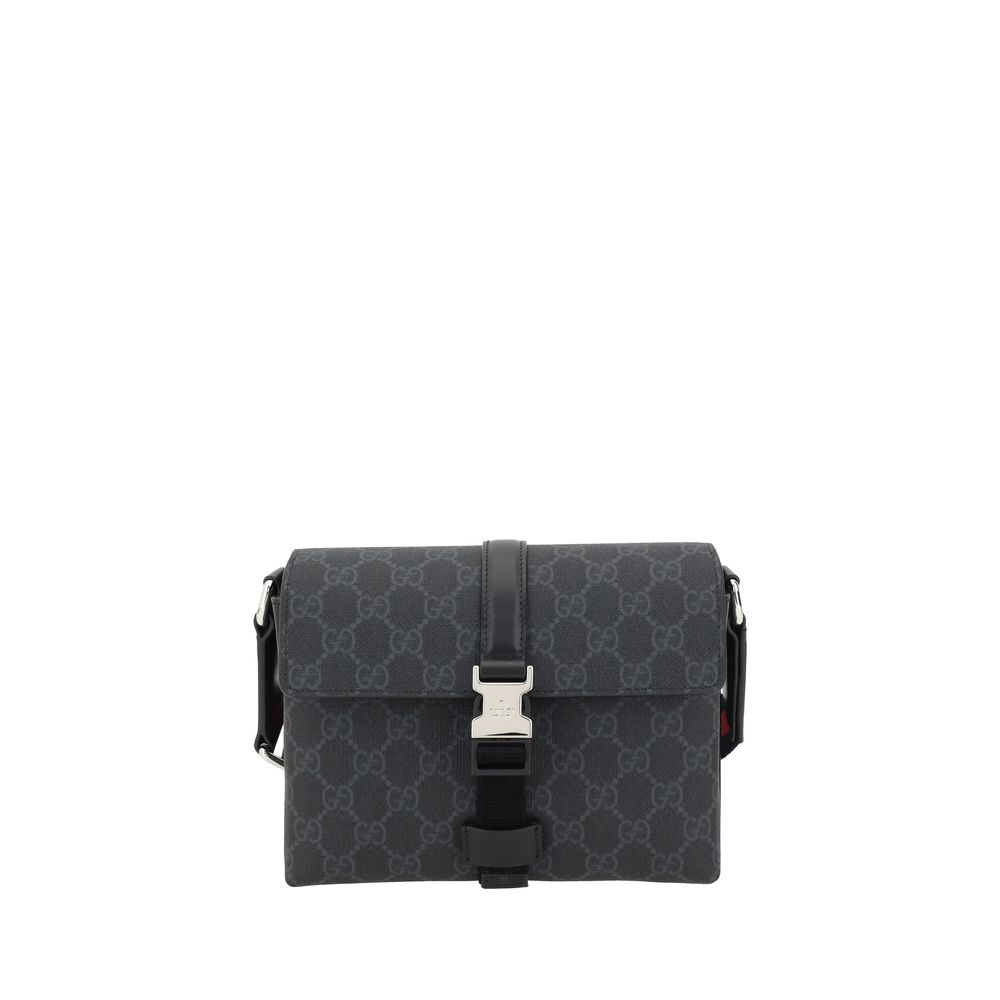 Black Polyethylene WalletGucci’s Mini GG Shoulder Bag features an adjustable webbing shoulder strap for comfort and versatility. The front closure features a flap with an applied buckle for a practical and elegant touch. The iconic GG Supreme pattern is r