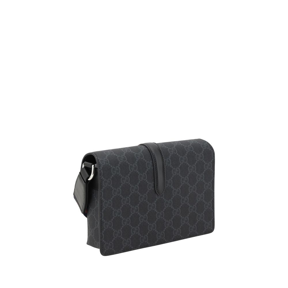 Black Polyethylene WalletGucci’s Mini GG Shoulder Bag features an adjustable webbing shoulder strap for comfort and versatility. The front closure features a flap with an applied buckle for a practical and elegant touch. The iconic GG Supreme pattern is r