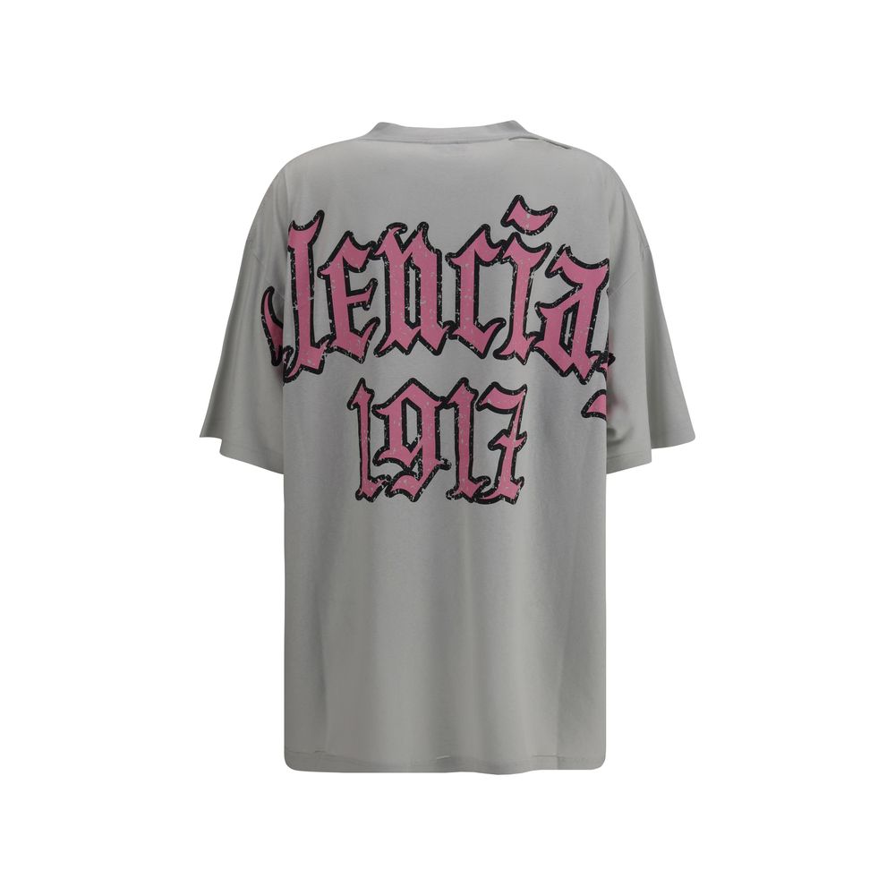 Gray Cotton T-ShirtCotton T-shirt by Balenciaga, featuring a vintage design with a worn effect. The model features a classic ribbed crew neck and an oversized fit that gives a relaxed, contemporary look. On the back, the iconic Balenciaga monogram in cont