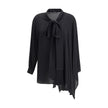 Black Silk BlouseBalenciaga’s asymmetrical Blouse is made of lightweight and fluid pure silk georgette. The sophisticated design is enriched with elegant ribbons to tie at the neck, a batwing sleeve and a long sleeve with a button-adjustable cuff. The fro