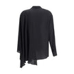 Black Silk BlouseBalenciaga’s asymmetrical Blouse is made of lightweight and fluid pure silk georgette. The sophisticated design is enriched with elegant ribbons to tie at the neck, a batwing sleeve and a long sleeve with a button-adjustable cuff. The fro