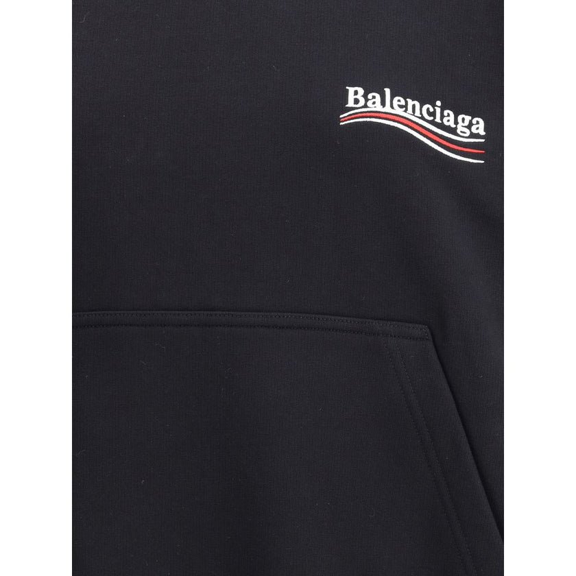 Black Cotton SweatshirtCotton Hoodie by Balenciaga features an oversized cut with a bold character. The design features a double-slider front zipper, two patch welt pockets on the front, and ribbed cuffs and hem for a structured fit. The iconic contrastin