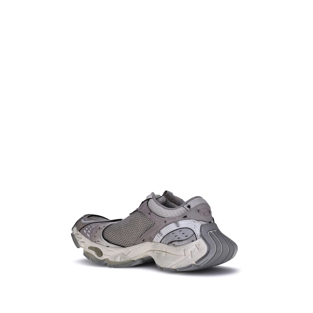 Gray Polyethylene Athletic SneakersBalenciaga’s Stapler Sneakers embody the brand’s unconventional and experimental spirit, combining deconstructed aesthetics and avant-garde details. The worn-effect design gives the shoe an intentionally worn-in look, wh