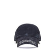 Black Cotton Cap (Baseball Hat)Balenciaga’s Blackletter Script Baseball Hat combines bold style with functional details. Featuring embroidered ventilation eyelets on the top, it has a cut-out visor on both sides and an adjustable pull tab with hook-and-lo