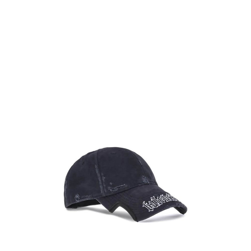 Black Cotton Cap (Baseball Hat)Balenciaga’s Blackletter Script Baseball Hat combines bold style with functional details. Featuring embroidered ventilation eyelets on the top, it has a cut-out visor on both sides and an adjustable pull tab with hook-and-lo