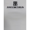 White Viscose TopTop by Balenciaga, featuring the iconic contrast monogram printed on the front. Made of stretch fabric, this style features a slim fit that enhances the silhouette, perfect for modern, minimalist looks. Ideal to wear alone or paired with