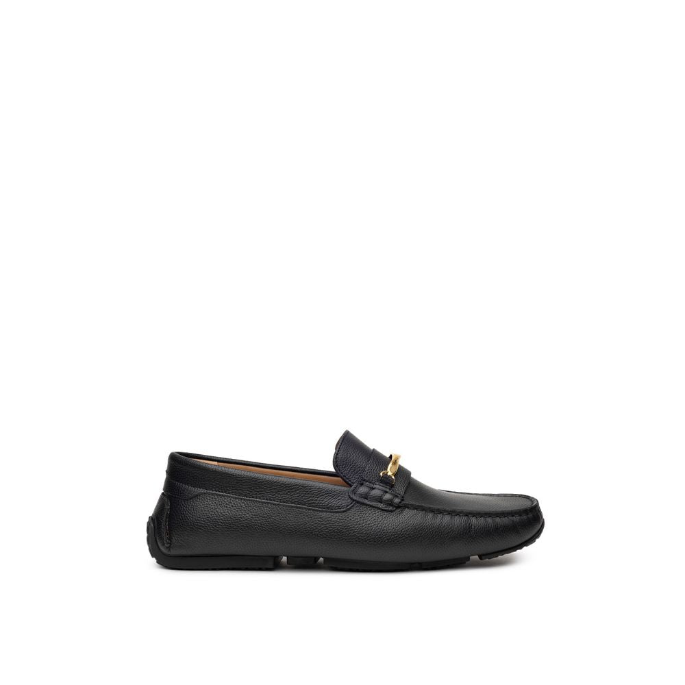 Black Leather MoccassinBally Loafers in Black Leather with Gold Plaque. In black hammered leather, rounded toe, insole with logo, tone-on-tone stitching, applied gold metallic details. Segmented rubber outsole. Size 7-8-9-10-11EU – 39-40.5-42.5-44-45IT Co