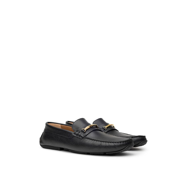 Black Leather MoccassinBally Loafers in Black Leather with Gold Plaque. In black hammered leather, rounded toe, insole with logo, tone-on-tone stitching, applied gold metallic details. Segmented rubber outsole. Size 7-8-9-10-11EU – 39-40.5-42.5-44-45IT Co
