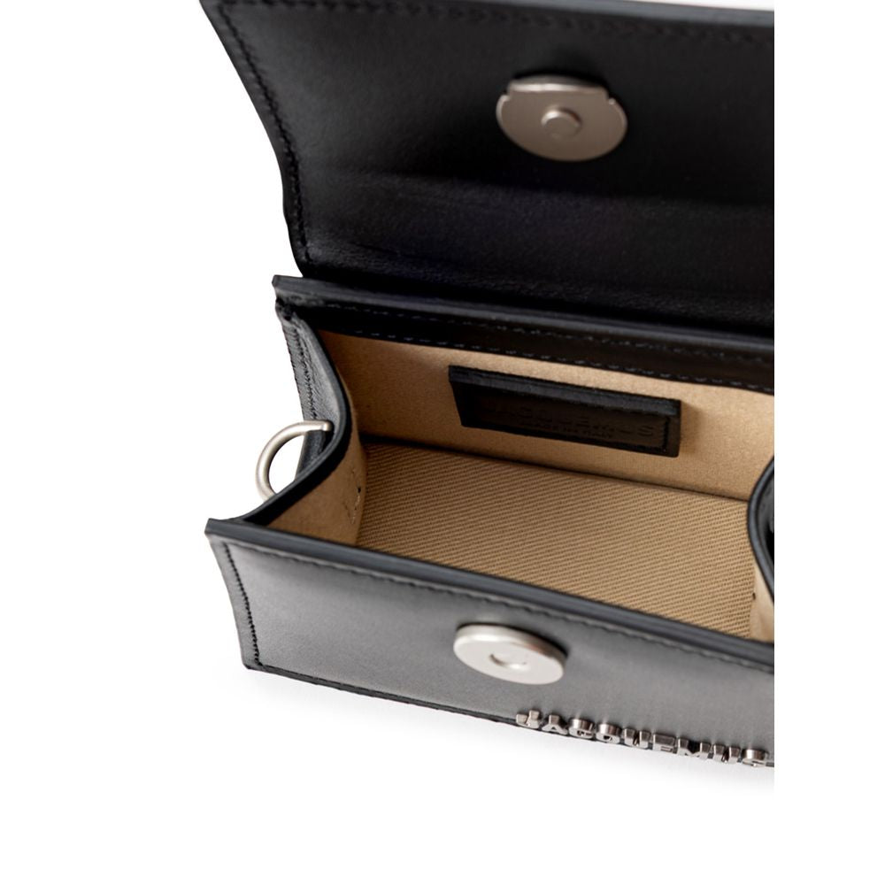 Black Leather HandbagJacquemus Black Leather Mini Le Chiquito Bag. In black leather, front opening with hidden snap button, single compartment. Silver metal logo on the side. Composition: 100% Leather Internal SKU: 25MG114 Brand SKU: 216BA0013061990Black