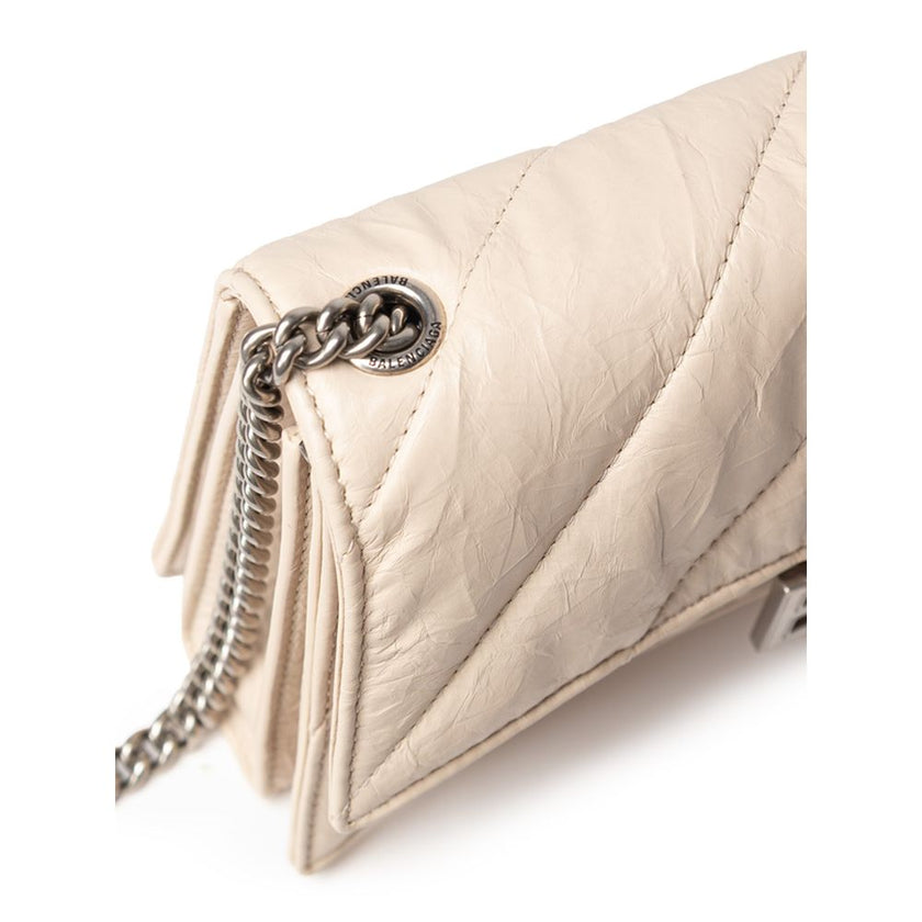 Beige Leather Shoulder BagBalenciaga Small Crush Bag in Beige with Chain. In quilted leather with a wrinkled effect, front closure with covered snap button and metal BB logo. Internal compartment and zip pocket, compartments and metal chain. Composition: