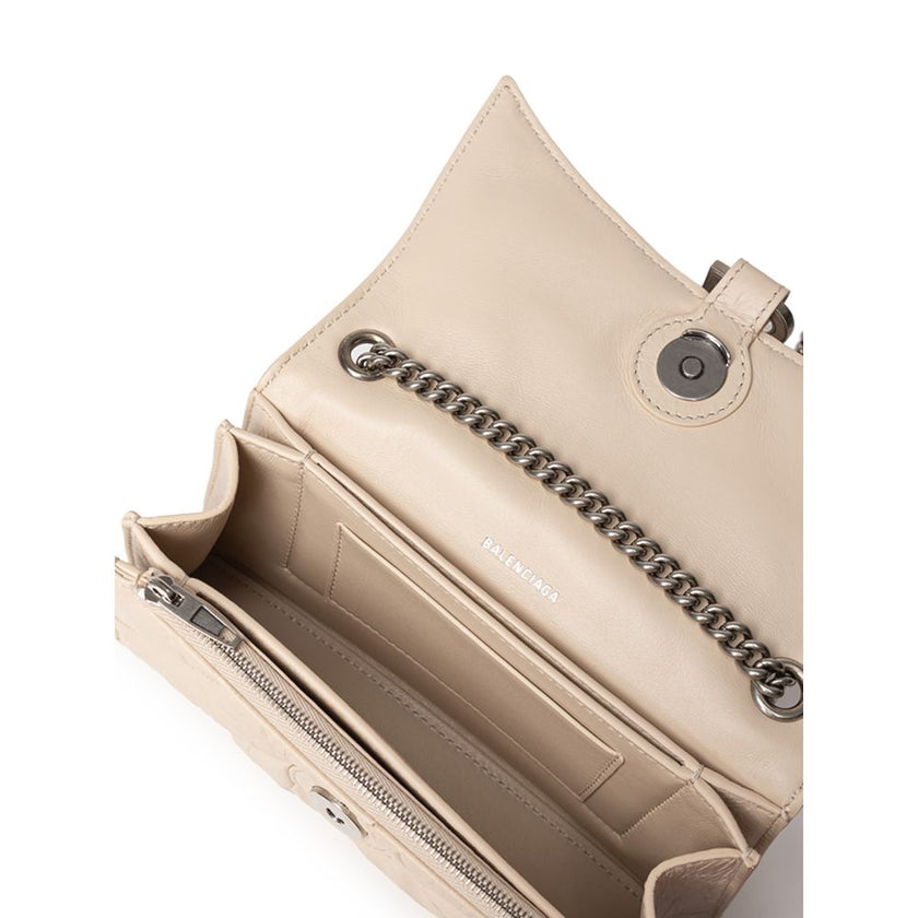 Beige Leather Shoulder BagBalenciaga Small Crush Bag in Beige with Chain. In quilted leather with a wrinkled effect, front closure with covered snap button and metal BB logo. Internal compartment and zip pocket, compartments and metal chain. Composition: