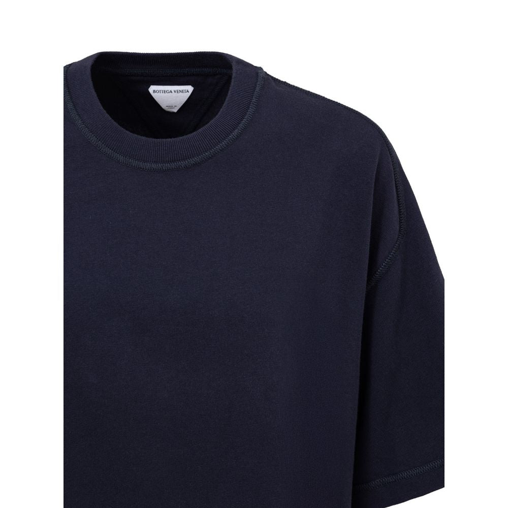 Blue Cotton T-ShirtBottega Veneta Blue Square Neck Cropped T-Shirt. In double Japanese cotton jersey, black, short sleeves, straight bottom, oversized fit. Composition: 100% Cotton Brand SKU: 707791VKLZ0032 4038 Internal SKU: 25MAR122Blue Cotton T-Shirt${