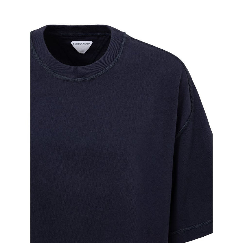 Blue Cotton T-ShirtBottega Veneta Blue Square Neck Cropped T-Shirt. In double Japanese cotton jersey, black, short sleeves, straight bottom, oversized fit. Composition: 100% Cotton Brand SKU: 707791VKLZ0032 4038 Internal SKU: 25MAR122Blue Cotton T-Shirt${