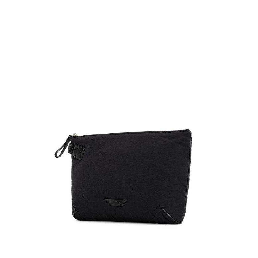 Black Nylon Clutch BagBottega Veneta Black Nylon Light Paper Clutch. Padded nylon clutch bag, top zip opening and leather pull. Single compartment, inside pocket. Leather tag with tone-on-tone printed logo, removable leather handle with woven motif. Compo