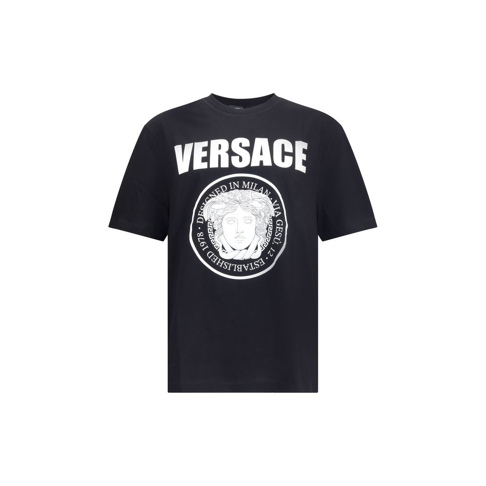 Black Cotton T-ShirtCotton T-Shirt by Versace featuring a ribbed crew neck and iconic contrasting monogram on the front, embellished with a Medusa maxi head. A distinctive garment that combines comfort and bold style. Season: AW25 Fit: Regular Composition