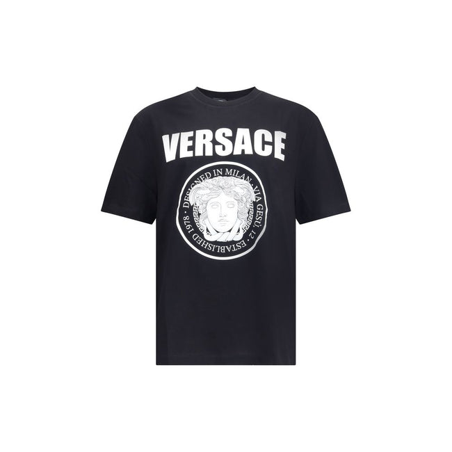 Black Cotton T-ShirtCotton T-Shirt by Versace featuring a ribbed crew neck and iconic contrasting monogram on the front, embellished with a Medusa maxi head. A distinctive garment that combines comfort and bold style. Season: AW25 Fit: Regular Composition