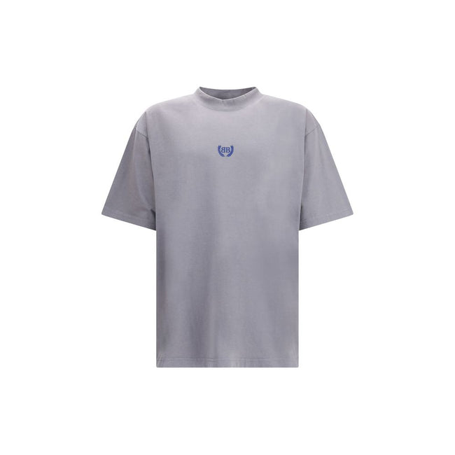 Gray Cotton T-ShirtBalenciaga’s cotton T-Shirt features a classic ribbed crew neck and the iconic BB logo embroidered on the front, adding a distinctive touch of luxury. The vintage worn-effect design gives the T-shirt a unique look, as if it has already