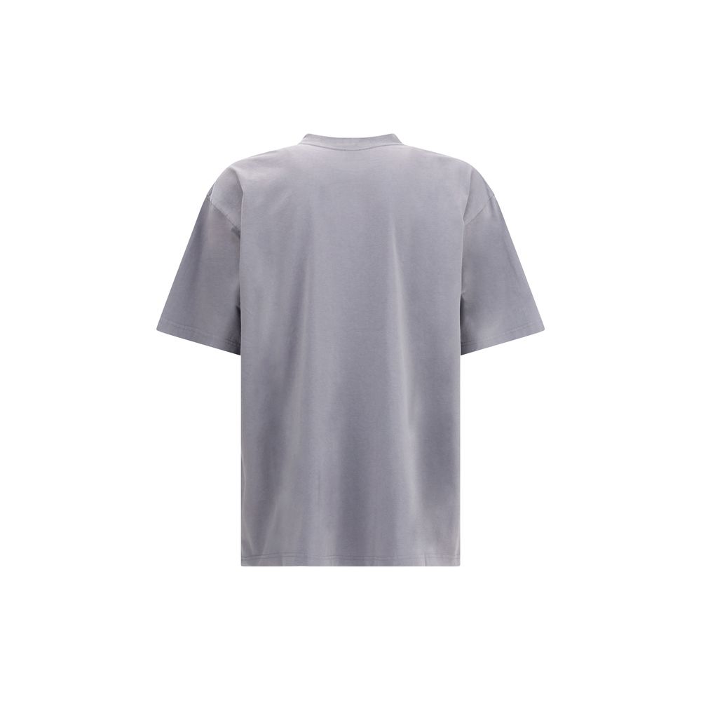 Gray Cotton T-ShirtBalenciaga’s cotton T-Shirt features a classic ribbed crew neck and the iconic BB logo embroidered on the front, adding a distinctive touch of luxury. The vintage worn-effect design gives the T-shirt a unique look, as if it has already