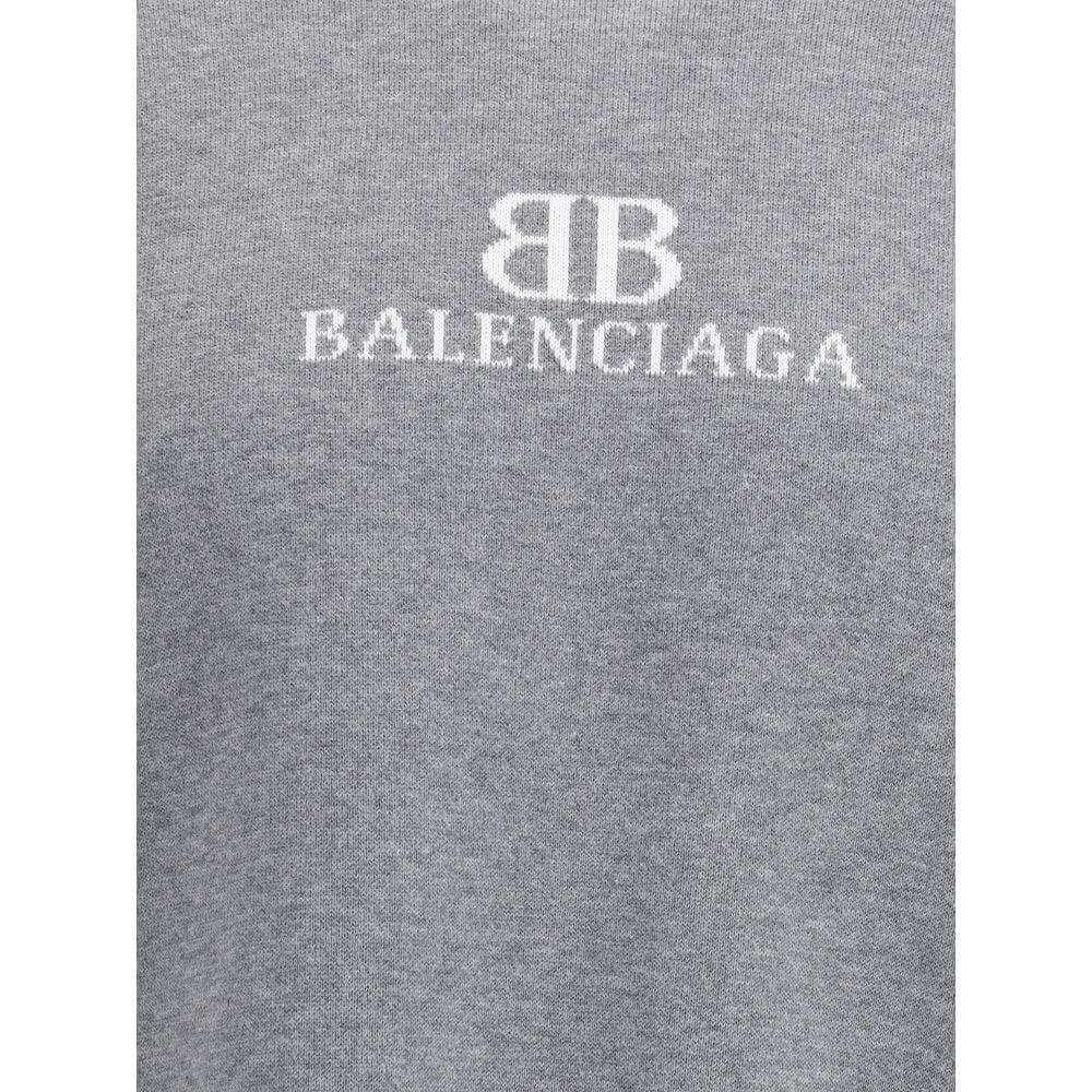 Gray Cotton SweatshirtCotton Sweater by Balenciaga features a ribbed crew neck that ensures comfort and style. The garment features the iconic contrasting monogram on the front, a distinctive element that enhances the design. Ribbed cuffs and hem complete
