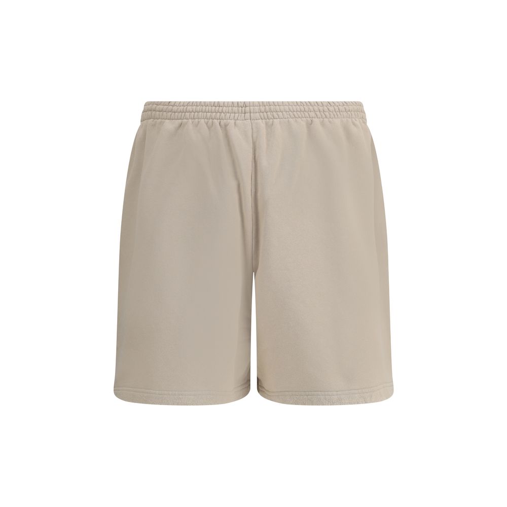 Beige Cotton Bermuda ShortsCotton tracksuit Shorts by Balenciaga feature an elasticized waistband and adjustable inner drawstring for personalized comfort. They feature two American-style side pockets and are embellished with the iconic tone-on-tone embro