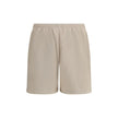 Beige Cotton Bermuda ShortsCotton tracksuit Shorts by Balenciaga feature an elasticized waistband and adjustable inner drawstring for personalized comfort. They feature two American-style side pockets and are embellished with the iconic tone-on-tone embro