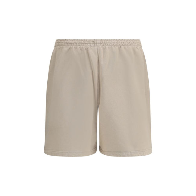 Beige Cotton Bermuda ShortsCotton tracksuit Shorts by Balenciaga feature an elasticized waistband and adjustable inner drawstring for personalized comfort. They feature two American-style side pockets and are embellished with the iconic tone-on-tone embro