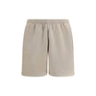 Beige Cotton Bermuda ShortsCotton tracksuit Shorts by Balenciaga feature an elasticized waistband and adjustable inner drawstring for personalized comfort. They feature two American-style side pockets and are embellished with the iconic tone-on-tone embro