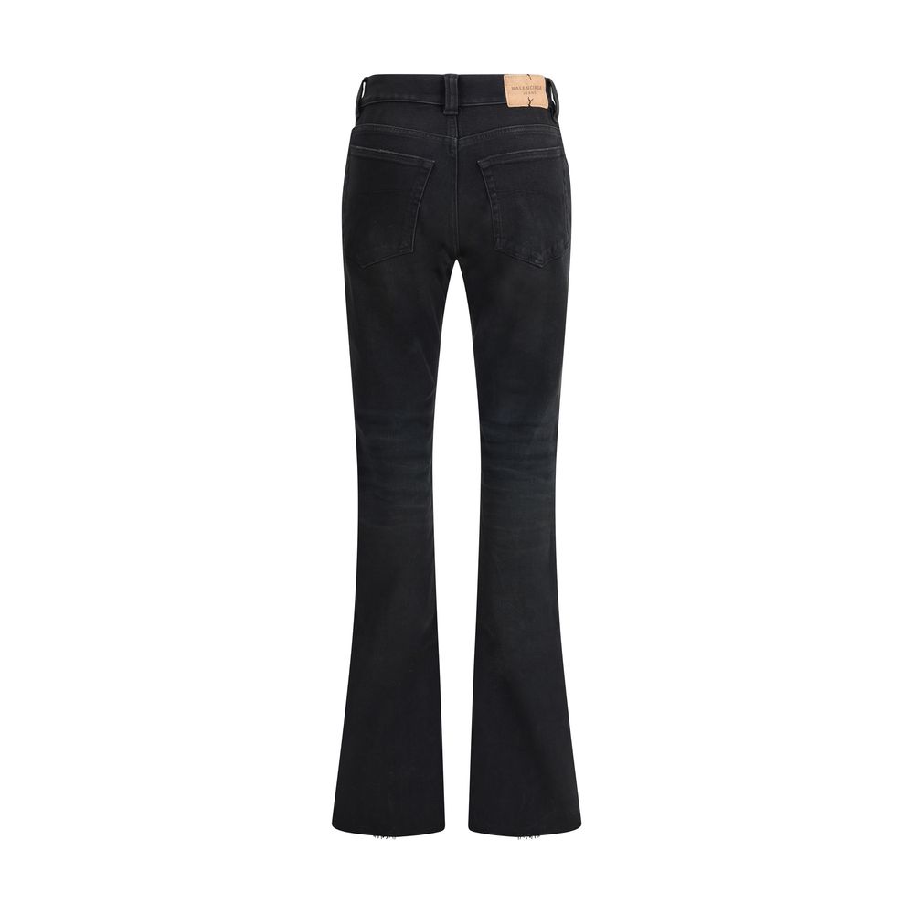 Black Cotton Bootcut JeansBalenciaga’s cotton Jeans combine contemporary design and distinctive details. Featuring a front zipper and button closure, they feature belt loops and a slim fit bootcut pattern that flatters the figure. The five-pocket cut is c
