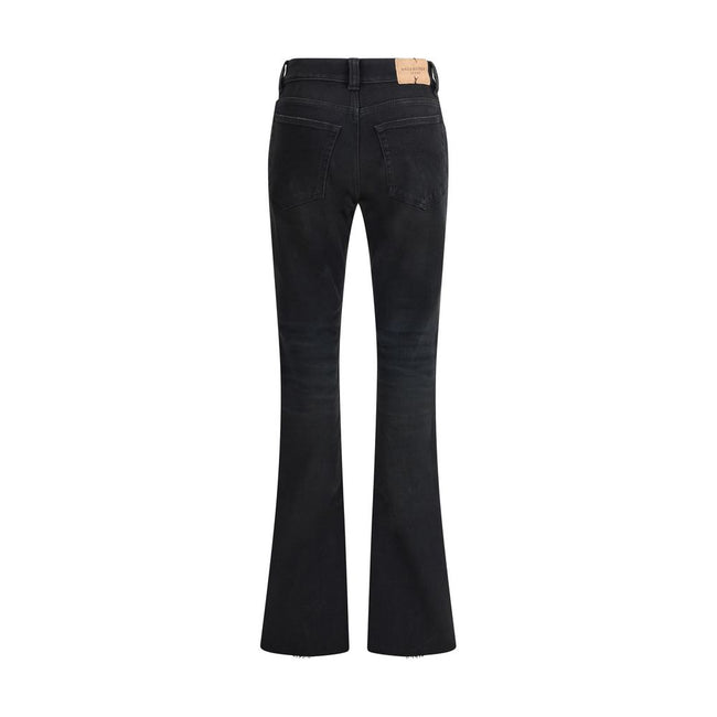 Black Cotton Bootcut JeansBalenciaga’s cotton Jeans combine contemporary design and distinctive details. Featuring a front zipper and button closure, they feature belt loops and a slim fit bootcut pattern that flatters the figure. The five-pocket cut is c
