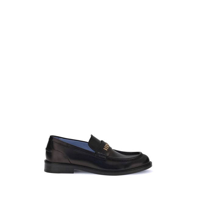 Black Calf Leather Bos Taurus Slip-On LoafersVersace’s Leather Loafers combine elegance and practicality in a slip-on design. Featuring a rounded toe, they feature the gold logo applied to the front tray, giving a distinctive and refined touch to this cla