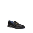 Black Calf Leather Bos Taurus Slip-On LoafersVersace’s Leather Loafers combine elegance and practicality in a slip-on design. Featuring a rounded toe, they feature the gold logo applied to the front tray, giving a distinctive and refined touch to this cla