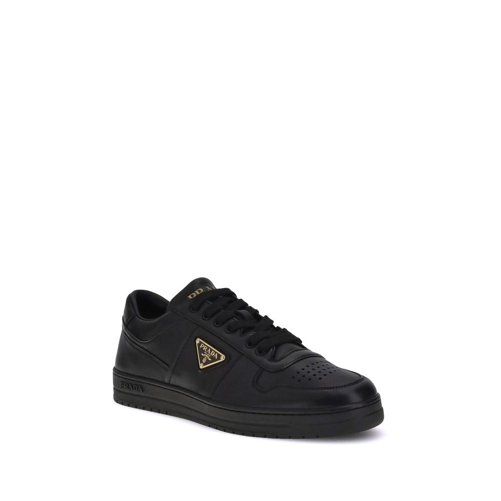 Downtown SneakersPrada’s Downtown leather Sneakers combine sporty lines and iconic details in a refined design. Featuring a paneled construction, they feature a lace-up front closure, perforated round toe and flat sole. The iconic triangular enameled Prad