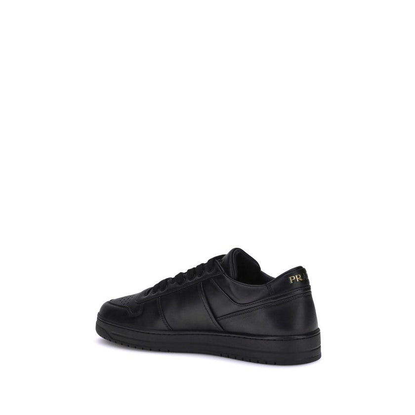 Downtown SneakersPrada’s Downtown leather Sneakers combine sporty lines and iconic details in a refined design. Featuring a paneled construction, they feature a lace-up front closure, perforated round toe and flat sole. The iconic triangular enameled Prad