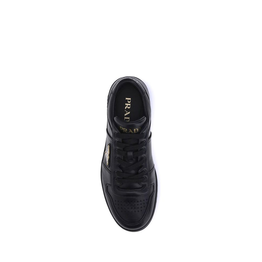 Downtown SneakersPrada’s Downtown leather Sneakers combine sporty lines and iconic details in a refined design. Featuring a paneled construction, they feature a lace-up front closure, perforated round toe and flat sole. The iconic triangular enameled Prad