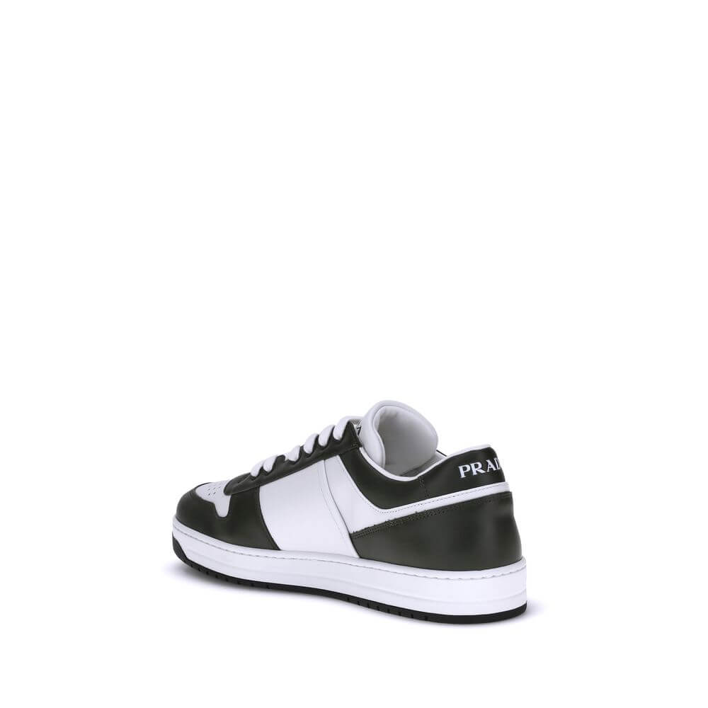 Black Calf Leather Bos Taurus Low Top SneakersStylish and contemporary leather Downtown Sneakers by Prada, these sneakers feature a front lace-up closure and the brand’s signature enameled triangular logo plaque applied to the side panel. The round, perfo