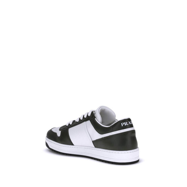 Black Calf Leather Bos Taurus Low Top SneakersStylish and contemporary leather Downtown Sneakers by Prada, these sneakers feature a front lace-up closure and the brand’s signature enameled triangular logo plaque applied to the side panel. The round, perfo