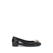 Black Rubber Ballet FlatsFerragamo’s Rubber Ballerina combines elegance and practicality with a sleek, modern design. The low block heel ensures comfort, while the side cut-out details lend lightness to the silhouette. The metallic logo bow on the front a