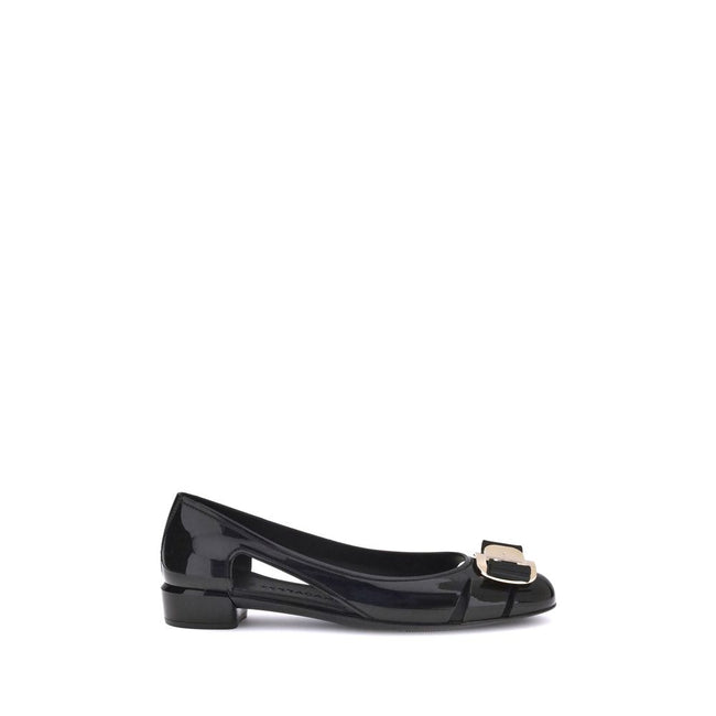 Black Rubber Ballet FlatsFerragamo’s Rubber Ballerina combines elegance and practicality with a sleek, modern design. The low block heel ensures comfort, while the side cut-out details lend lightness to the silhouette. The metallic logo bow on the front a